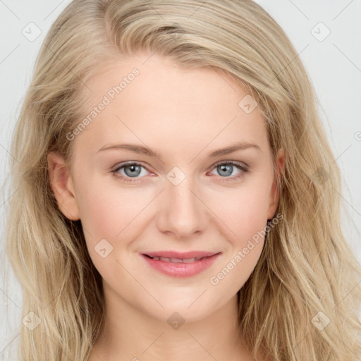 Joyful white young-adult female with long  brown hair and blue eyes