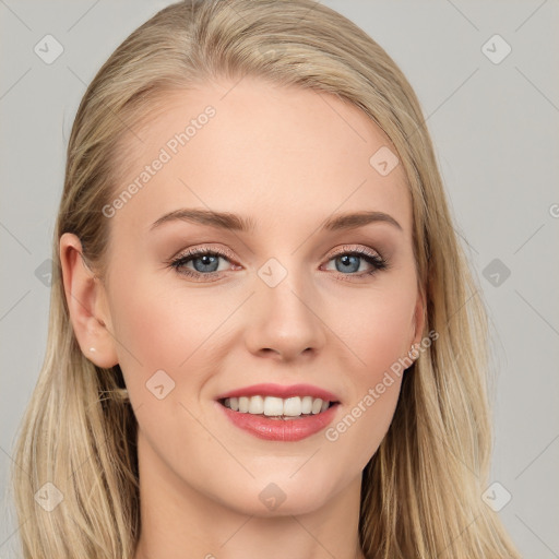 Joyful white young-adult female with long  brown hair and blue eyes