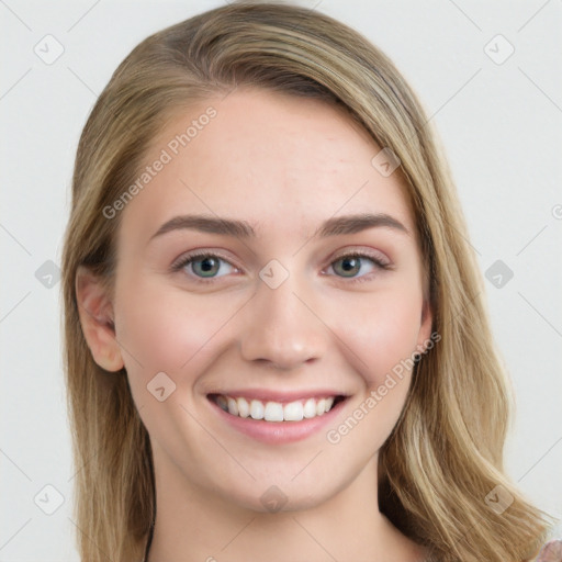 Joyful white young-adult female with long  brown hair and green eyes