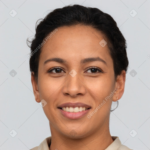 Joyful latino young-adult female with short  brown hair and brown eyes