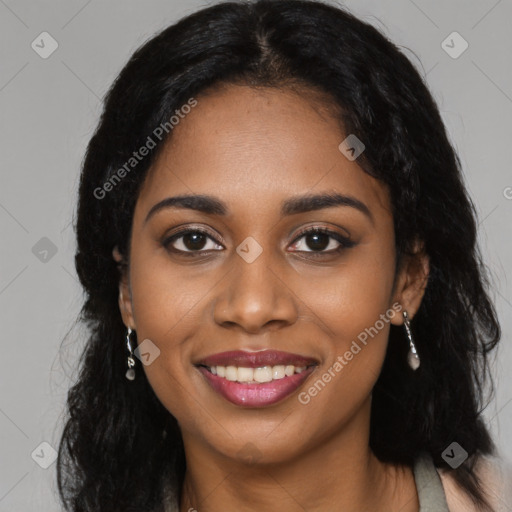 Joyful black young-adult female with long  black hair and brown eyes