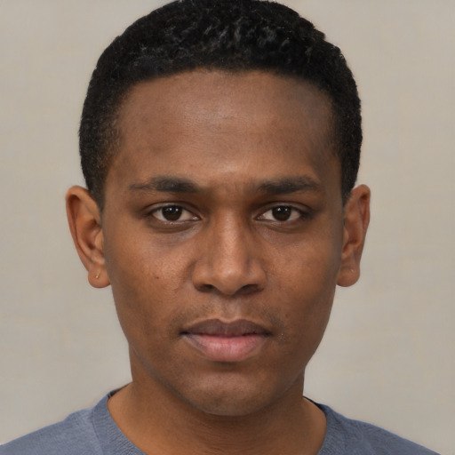 Neutral black young-adult male with short  black hair and brown eyes