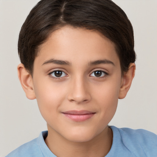 Joyful white child female with short  brown hair and brown eyes