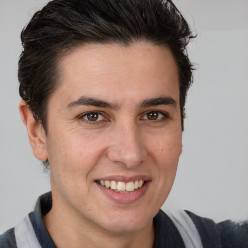 Joyful white young-adult male with medium  brown hair and brown eyes