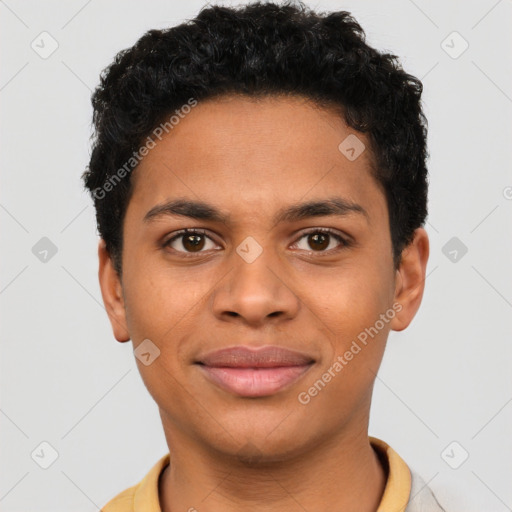 Joyful latino young-adult male with short  brown hair and brown eyes