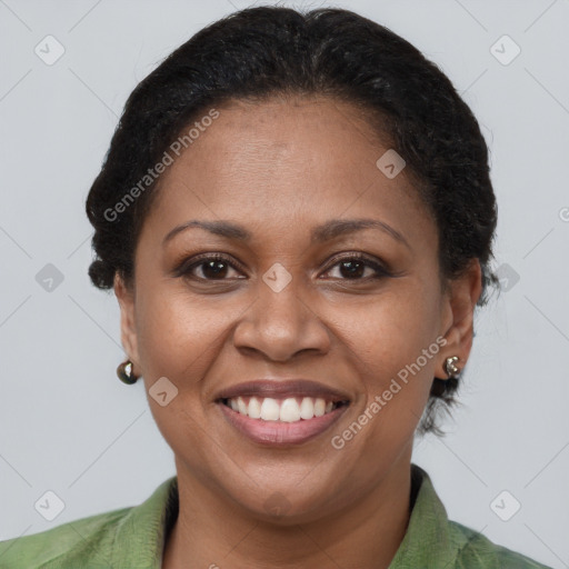 Joyful latino adult female with short  brown hair and brown eyes