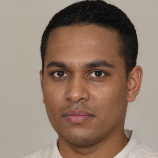 Neutral latino young-adult male with short  black hair and brown eyes