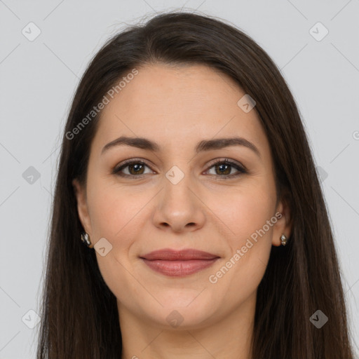 Joyful white young-adult female with long  brown hair and brown eyes