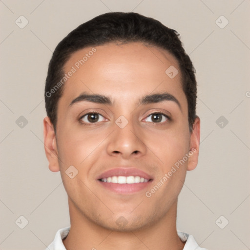 Joyful white young-adult male with short  black hair and brown eyes