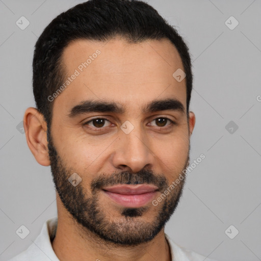 Joyful latino young-adult male with short  black hair and brown eyes