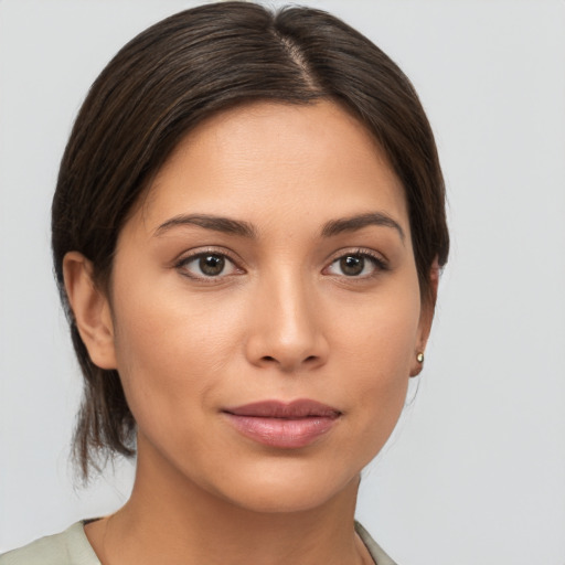 Joyful white young-adult female with medium  brown hair and brown eyes