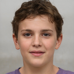 Joyful white child male with short  brown hair and brown eyes