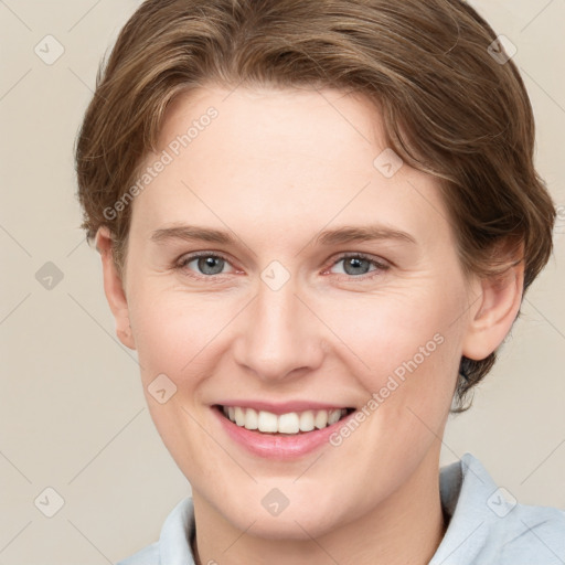 Joyful white young-adult female with short  brown hair and grey eyes