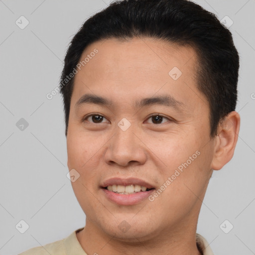 Joyful white young-adult male with short  brown hair and brown eyes