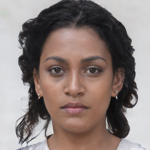 Neutral black young-adult female with medium  black hair and brown eyes