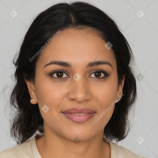 Joyful latino young-adult female with medium  brown hair and brown eyes