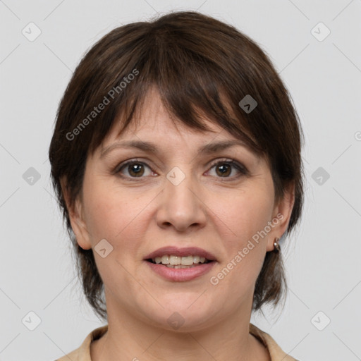 Joyful white adult female with medium  brown hair and grey eyes