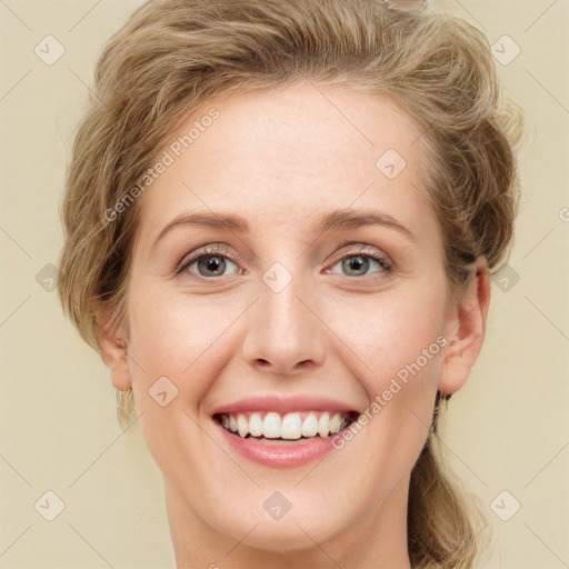 Joyful white young-adult female with long  brown hair and green eyes