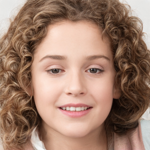 Joyful white child female with medium  brown hair and green eyes