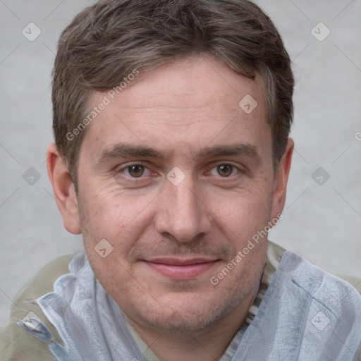 Joyful white adult male with short  brown hair and grey eyes