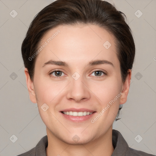 Joyful white young-adult female with short  brown hair and brown eyes