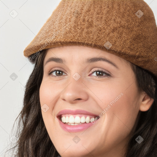 Joyful white young-adult female with long  brown hair and brown eyes