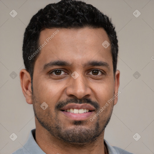 Joyful latino young-adult male with short  black hair and brown eyes