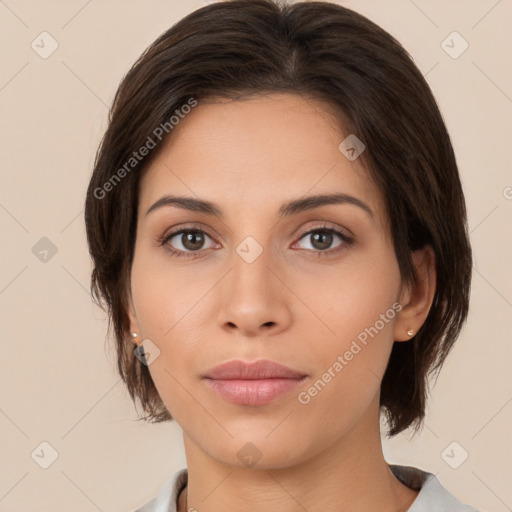 Neutral white young-adult female with medium  brown hair and brown eyes