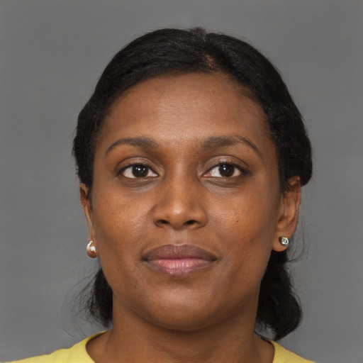 Joyful black young-adult female with medium  brown hair and brown eyes