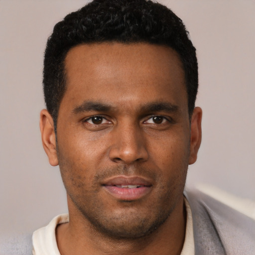 Neutral black young-adult male with short  brown hair and brown eyes