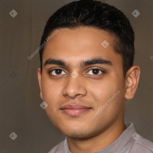 Joyful latino young-adult male with short  brown hair and brown eyes