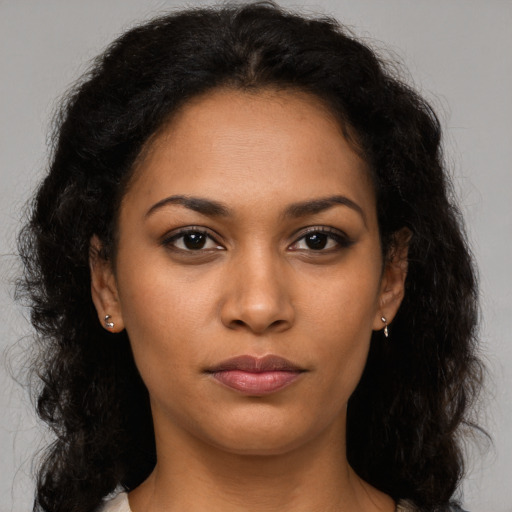 Neutral latino young-adult female with long  brown hair and brown eyes