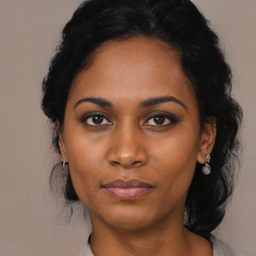 Neutral black young-adult female with medium  black hair and brown eyes