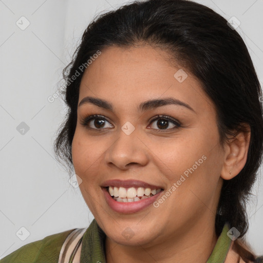 Joyful latino young-adult female with medium  brown hair and brown eyes