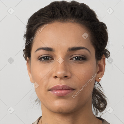 Joyful latino young-adult female with short  brown hair and brown eyes