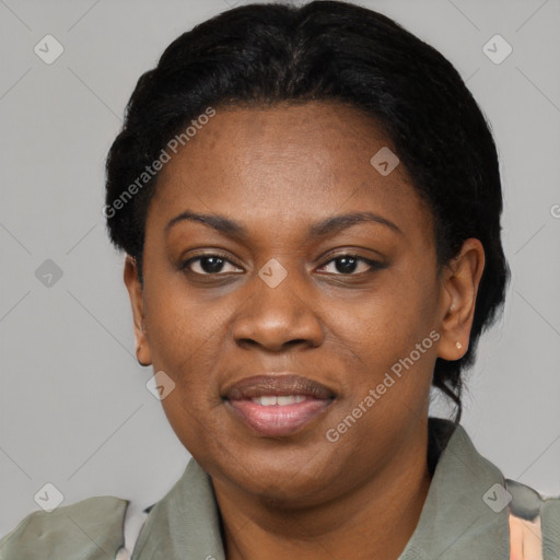 Joyful black adult female with short  black hair and brown eyes