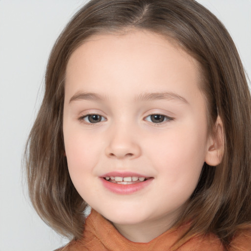 Joyful white child female with medium  brown hair and brown eyes