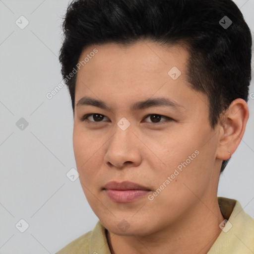 Joyful asian young-adult male with short  black hair and brown eyes
