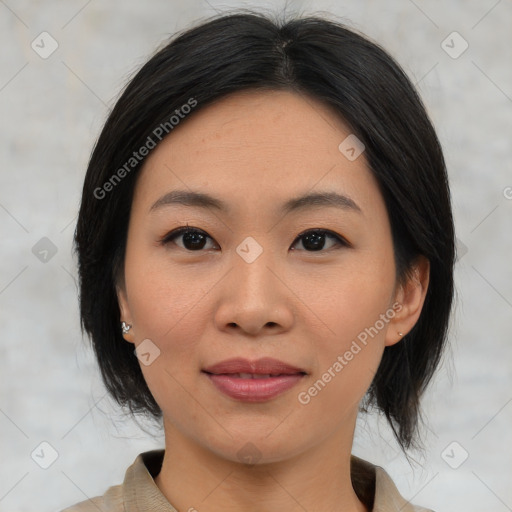 Joyful asian young-adult female with medium  black hair and brown eyes