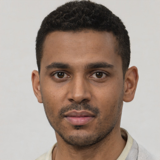 Neutral black young-adult male with short  black hair and brown eyes
