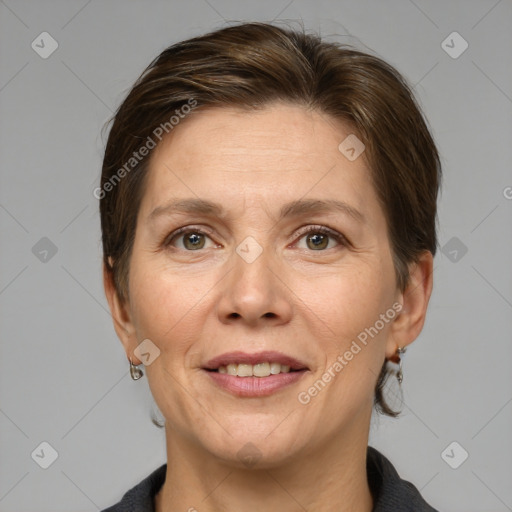 Joyful white adult female with medium  brown hair and grey eyes