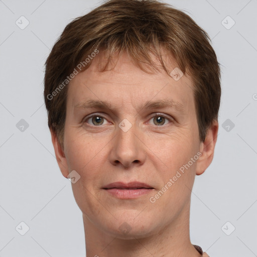 Joyful white adult male with short  brown hair and grey eyes