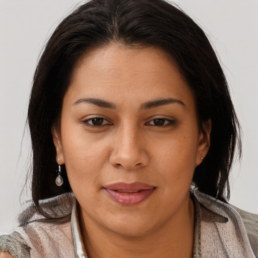 Joyful latino young-adult female with long  brown hair and brown eyes