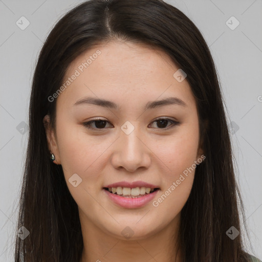 Joyful asian young-adult female with long  brown hair and brown eyes