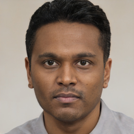 Neutral black young-adult male with short  black hair and brown eyes