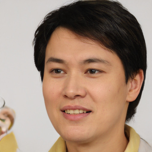 Joyful white young-adult male with medium  brown hair and brown eyes