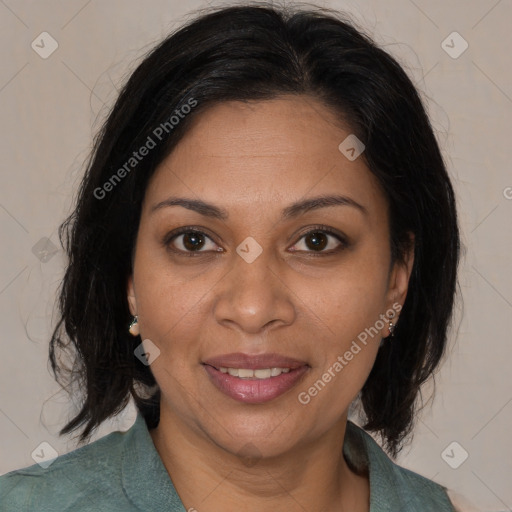 Joyful black adult female with medium  brown hair and brown eyes