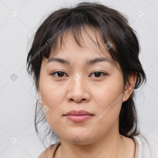 Joyful asian young-adult female with medium  brown hair and brown eyes