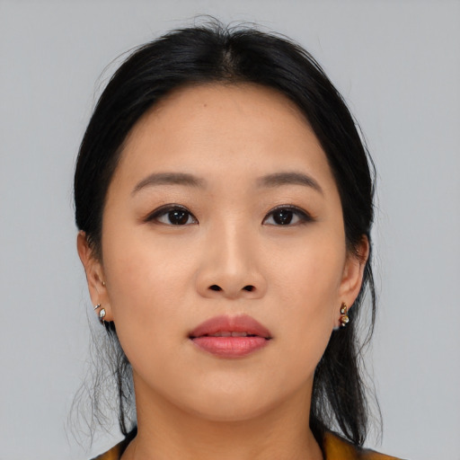 Joyful asian young-adult female with long  black hair and brown eyes