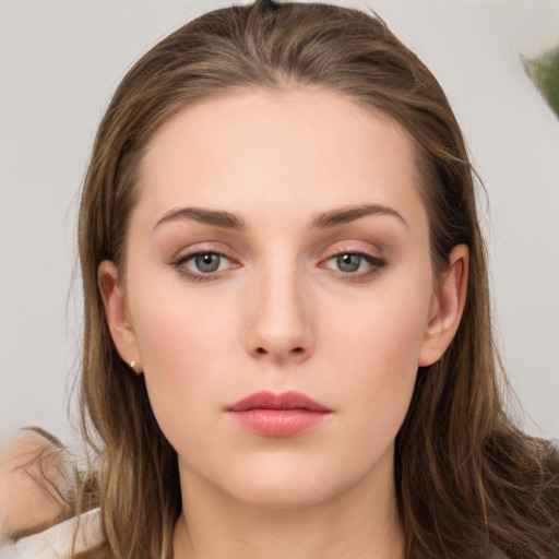 Neutral white young-adult female with long  brown hair and grey eyes